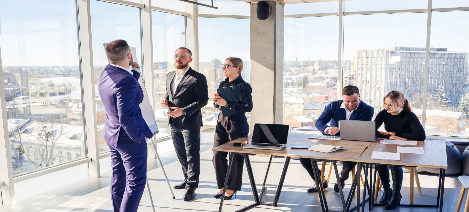 Confident Businessman Makes A Presentation Of A New Project Confident Businessman Makes A Presentation Of A New Project