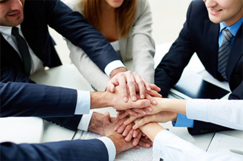 Employees hands above each other